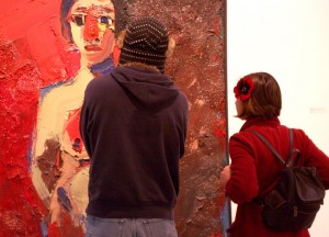Guests viewing Joan Brown's Girl Standing (Girl with Red Nose), 1962. di Rosa collection, Napa.
