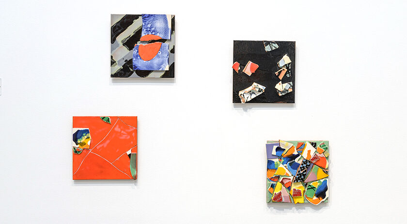 Six colorful tiles on a wall