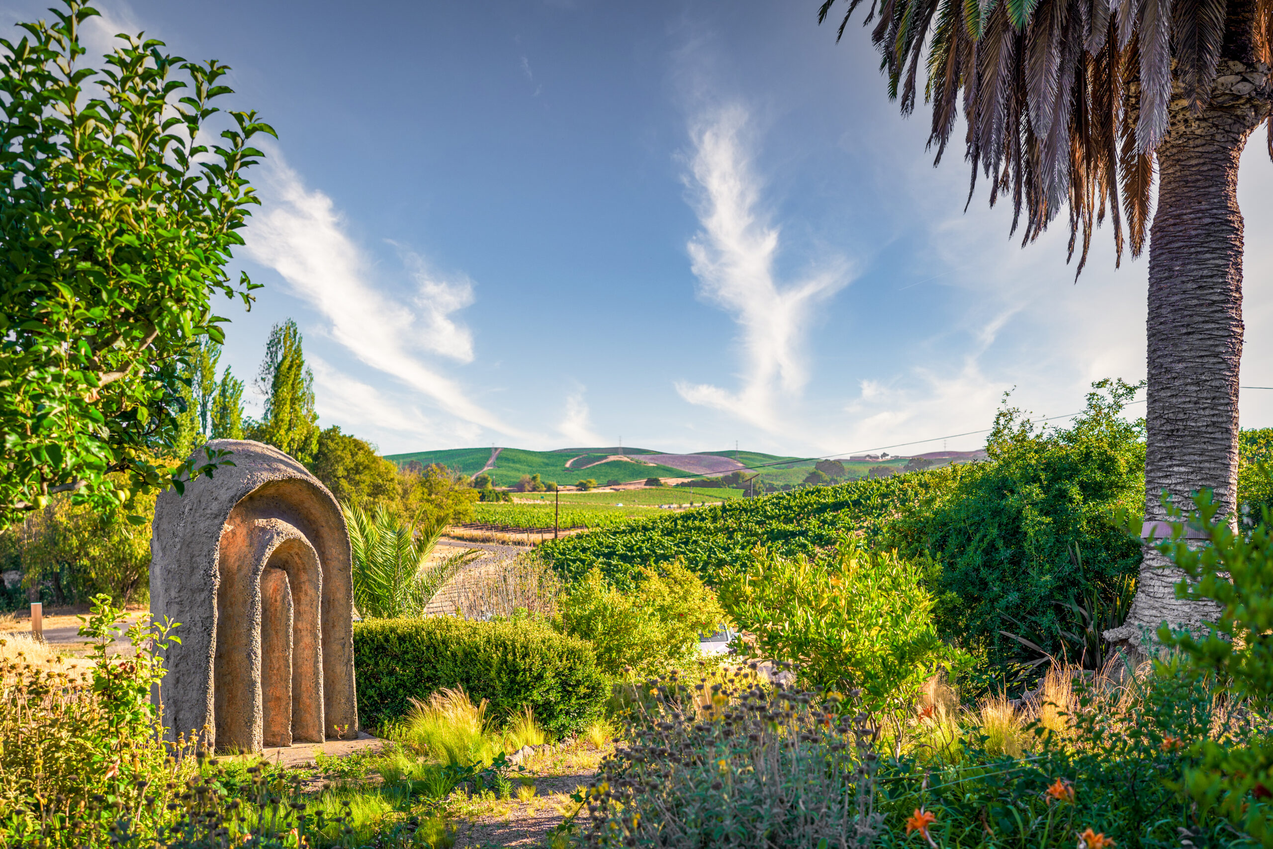 A large sculpture perches on a hill