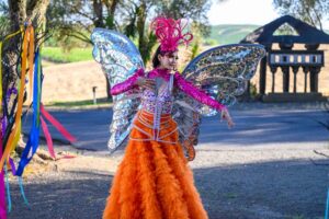 A person in a winged costume