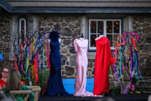 A trio of gowns on dress forms
