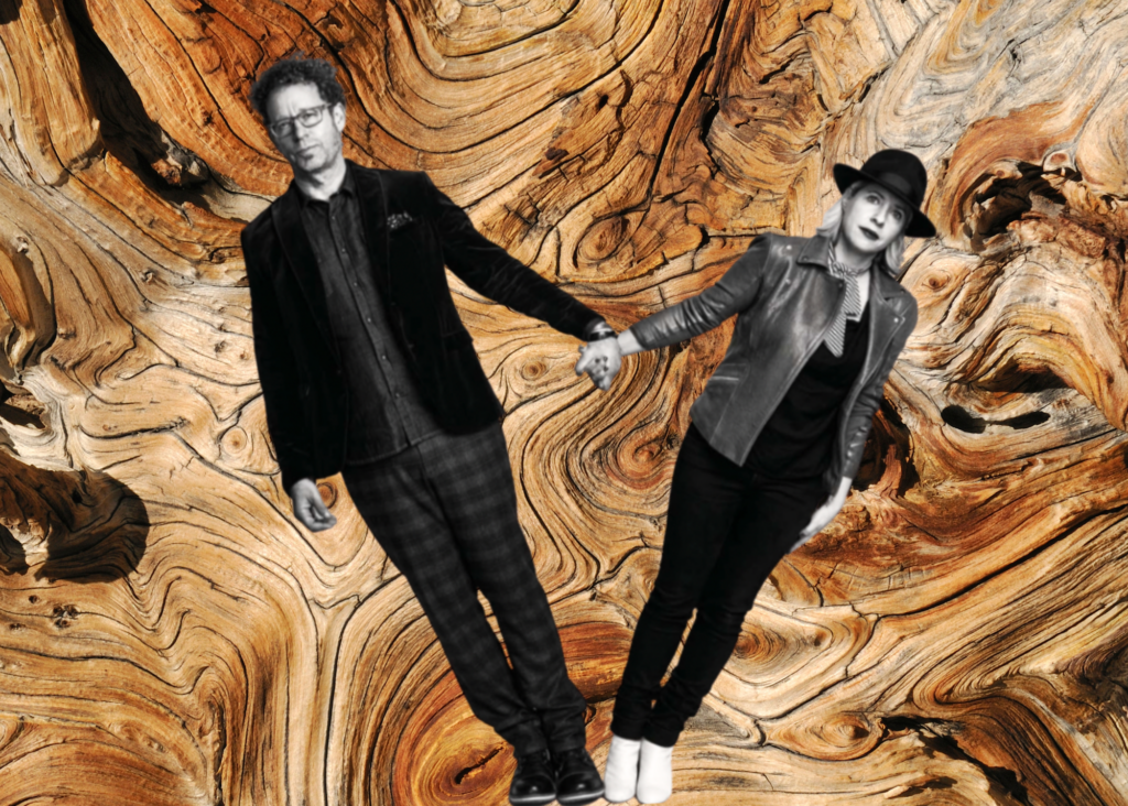 A black and white photo of two people holding hands and leaning away from each other overlaid on a photo of wood grain