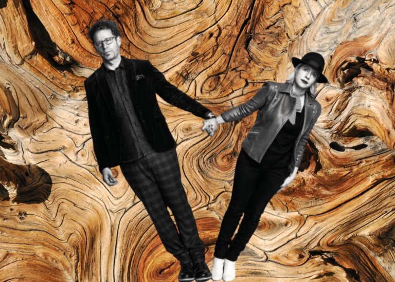 A black and white photo of two people holding hands and leaning away from each other overlaid on a photo of wood grain